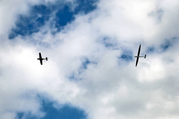 istock The plane is towing a glider in the sky 1399963018