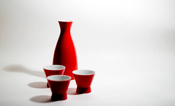 istock sake bottle red, on white background with dark shadows 139996418