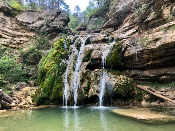 istock Waterfall into a natural swimming pool 1399965957