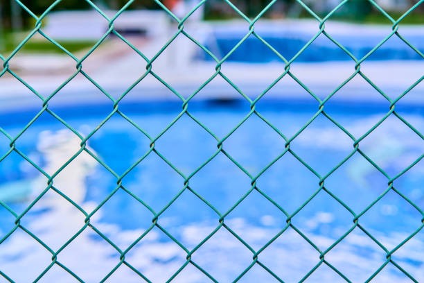 istock swimming pool safety fence 1399968113