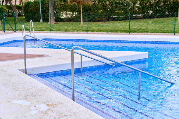 istock swimming pool with handrail and stairs 1399968145