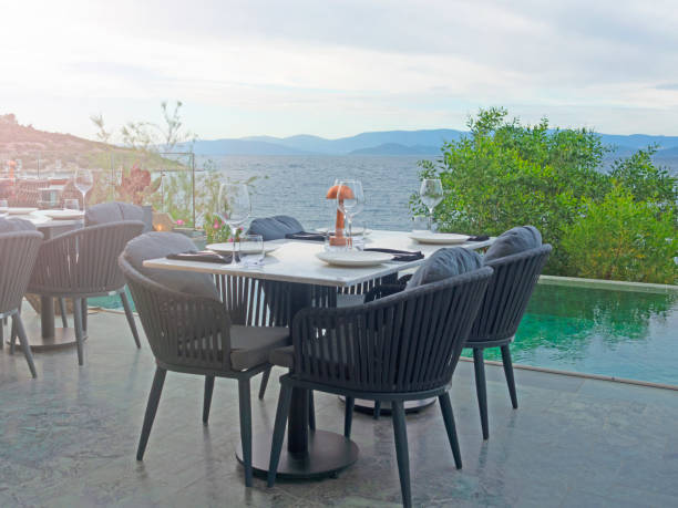 istock Dinner tables near the swimming pool 1399968515