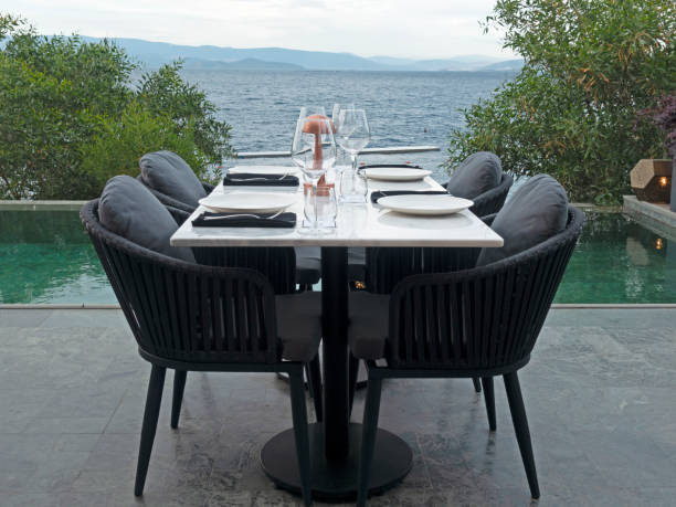 istock Dinner tables near the swimming pool 1399968574