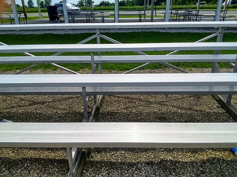 Spectator bleachers at a neighborhood youth baseball field in the park