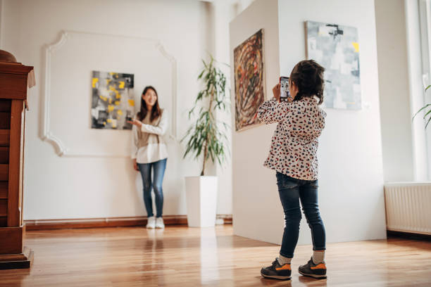 Mother and daughter in art gallery