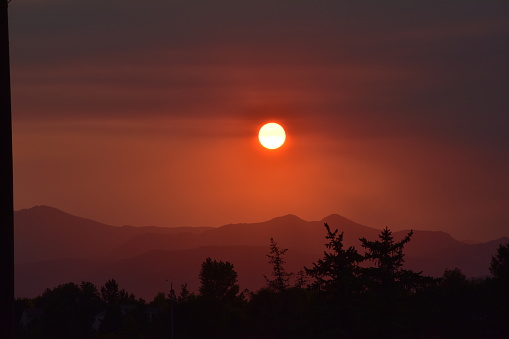 dark, smoke-filled skies in Longmont, Colorado due to the Cameron Peak Wildfire