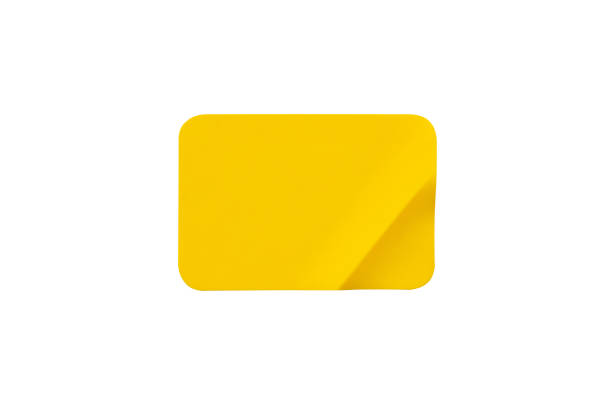 istock Yellow plastic sticker label isolated on white background 1399980995