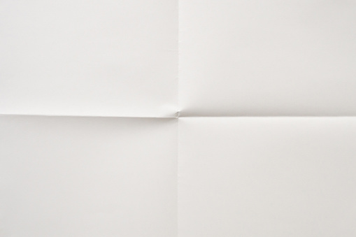 White folded and wrinkled paper texture background