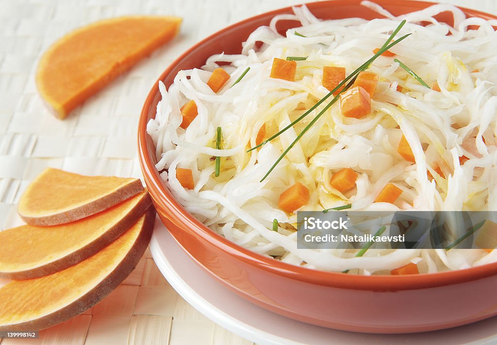 Sauerkraut salad with chunks of pumpkin and chives Block Shape Stock Photo