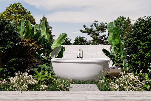 Bathtub standing on ground grass with back style concrete wall background,3D rendering
