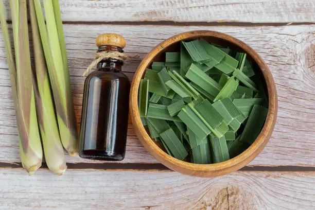fresh lemongrass leaves on table Lemongrass adds a distinctive citrus aroma and is used in Thai cuisine for its aroma, medicinal properties.