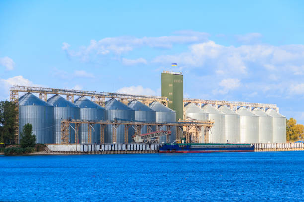 Modern granaries for storing cereal grains on a bank of the Dnieper river stock photo