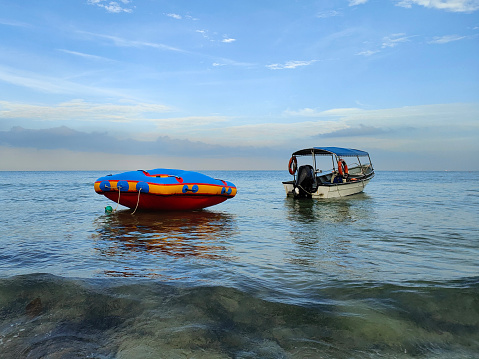 Inflatable recreation boats by the beach.