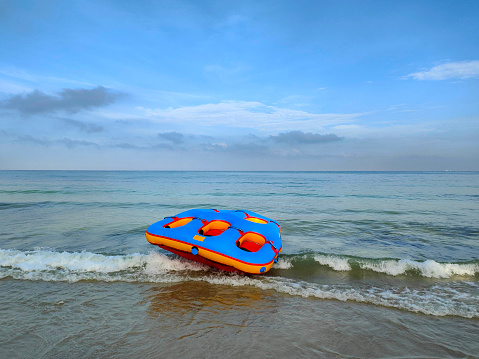 Inflatable recreation boats by the beach.