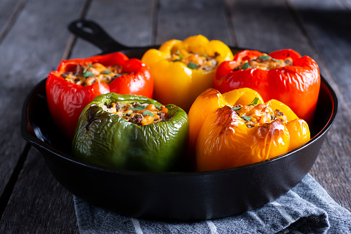 Halved bell pepper stuffed with minced white meat and carrot stuffing and baked in oven. Only vegetables and proteins, no other carbs. Hay diet, keto diet.