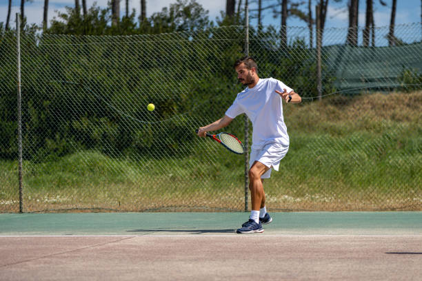 istock Tennis player hitting forehand at ball 1399989505