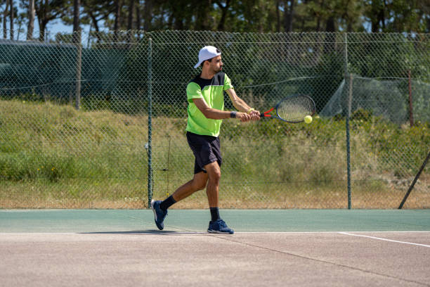 istock Tennis player hitting backhand at ball 1399989533