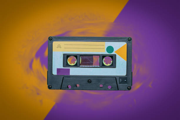 istock Retro tape recorder on a yellow-purple background. 1399992685