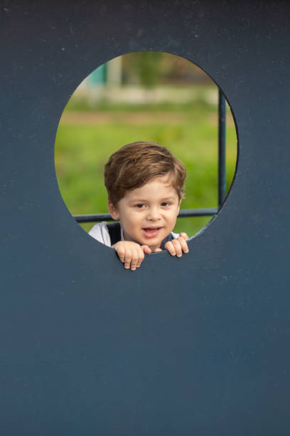 istock Cute little boy playing in the park 1399993572