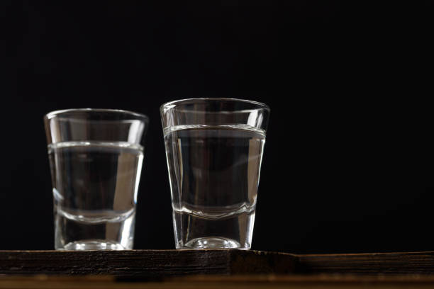 Vodka in a shot glass stock photo