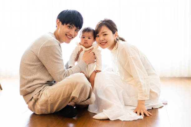 Happy Families Raising Children with Fun Happy Families Raising Children with Fun korean baby stock pictures, royalty-free photos & images