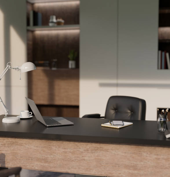 Modern CEO private office interior design with laptop, table lamp and accessories on tabletop