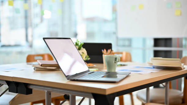 istock Modern office desk with notebook laptop on wood table in office room. 1400000644