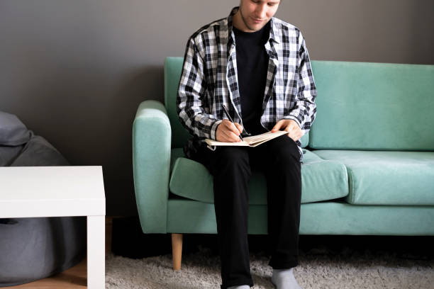 istock person making notes in the book staying at home 1400002336