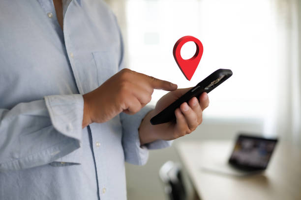 istock hand using a smartphone Holding GPS Map to Route Destination network connection Location Street Map with GPS Icons Navigation 1400003117
