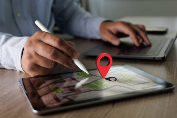 istock hand using a smartphone Holding GPS Map to Route Destination network connection Location Street Map with GPS Icons Navigation 1400003129