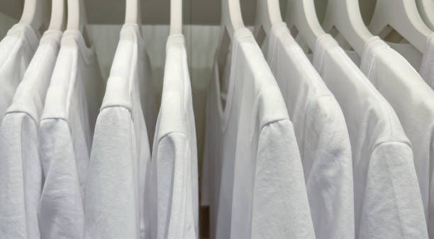 istock White sweatshirts hanging in the closet. 1400003304