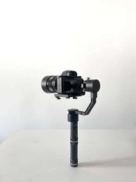 istock modern camera equipment, black stabilizer tripod with video cinema camera 1400003847