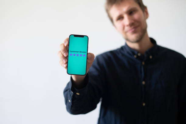 smartphone screen with five star quality review, positive feedback