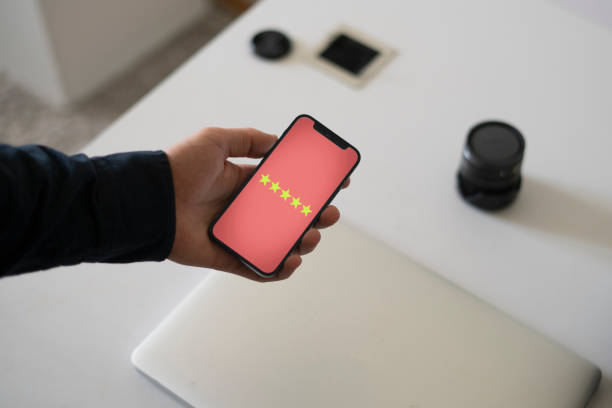 smartphone screen with five star quality review, positive feedback