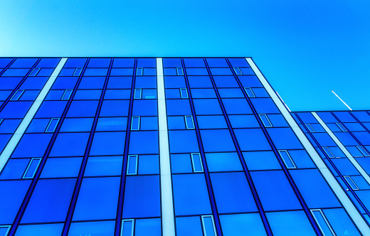 Modern glass facade building, Amsterdam, The Netherlands