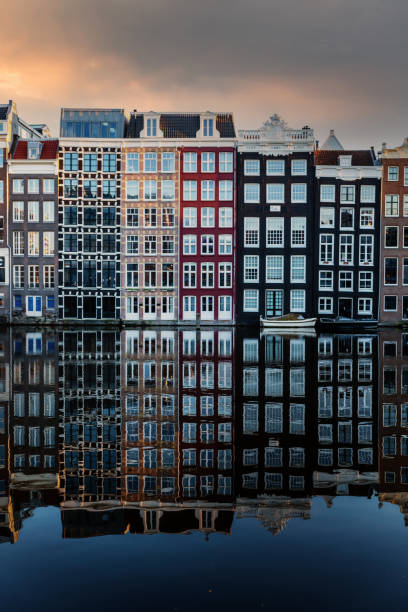 Amsterdam City Scene,  typical dutch houses and their reflection in the canal. stock photo