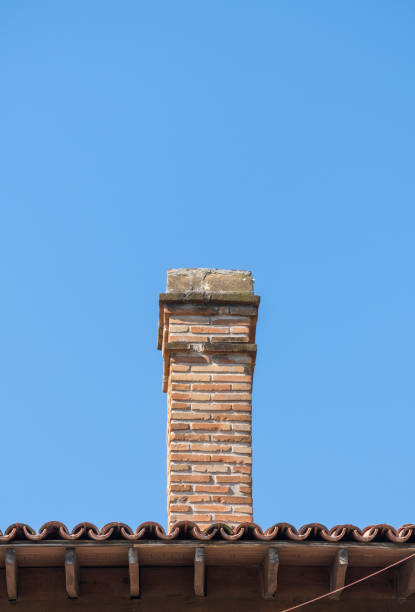 istock brick chimney on old and historical  building roof 1400012253