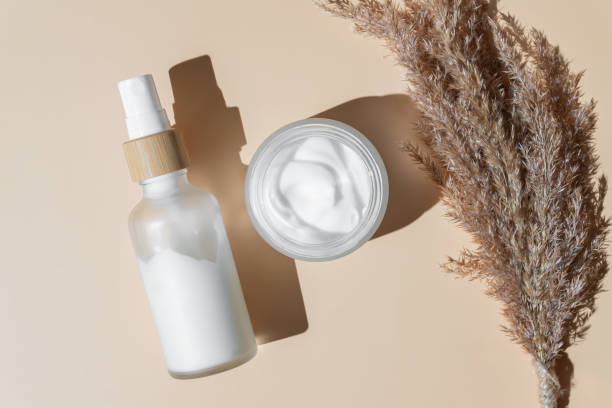istock Cosmetic container mock-ups. Trendy Background for branding and packaging presentation. Natural skincare beauty product concept. Serum. essence and spray beauty set 1400013359