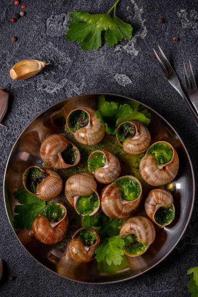 istock Bourgogne Escargot Snails with herb garlic oil. 1400014159