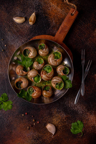 istock Bourgogne Escargot Snails with herb garlic oil. 1400014231