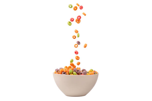 istock Colorful cereal box for morning breakfast. Corn flakes falling to the white bowl. Motion. 1400016269