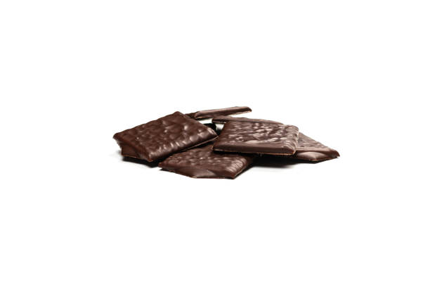 istock Dark chocolate candies isolated on white background. 1400016284