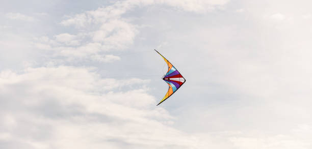 istock colorful kite flying in the wind. 1400016784