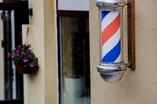 Old fashioned vintage barber shop pole. Blue red and white