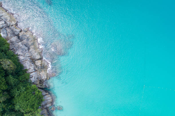 istock Aerial view Top down seashore wave crashing on seashore Beautiful turquoise sea surface in sunny day Good weather day summer background 1400016922