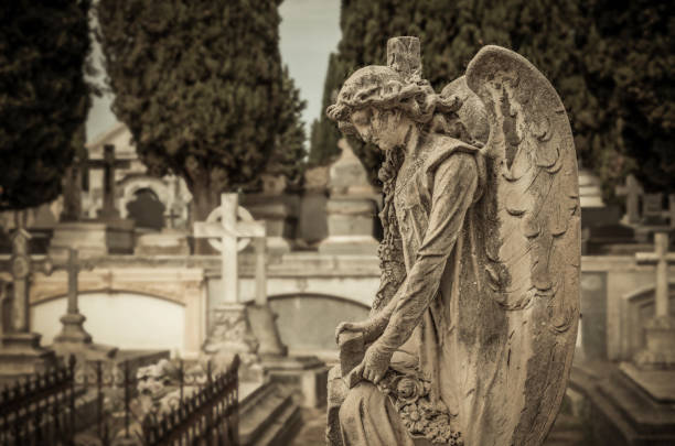 istock Old statue of angel in cemetery 1400019968