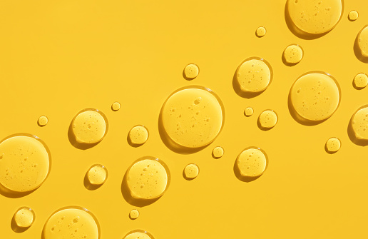 drops of serum test on a yellow background