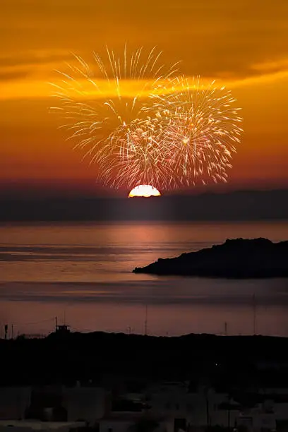 Golden hour in the sky with dazzling fireworks. Stock Image.