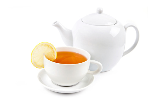 tea time - white teacup and teapot on white background