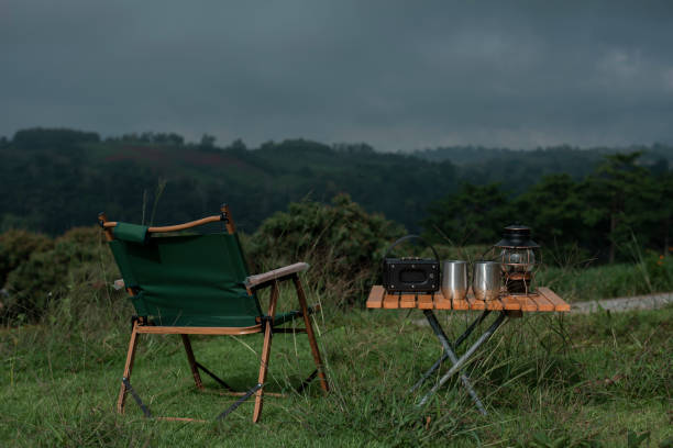 istock Table and chairs with drip coffee set in a camping atmosphere 1400021958